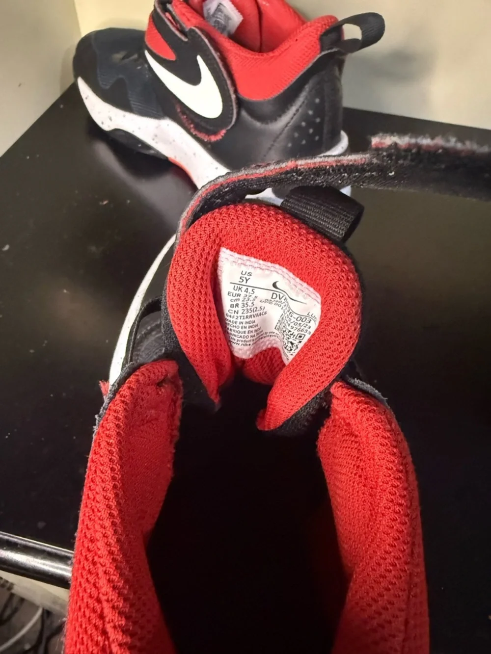 Nike Kids Black and Red Athletic Sneakers with White Speckled Midsole